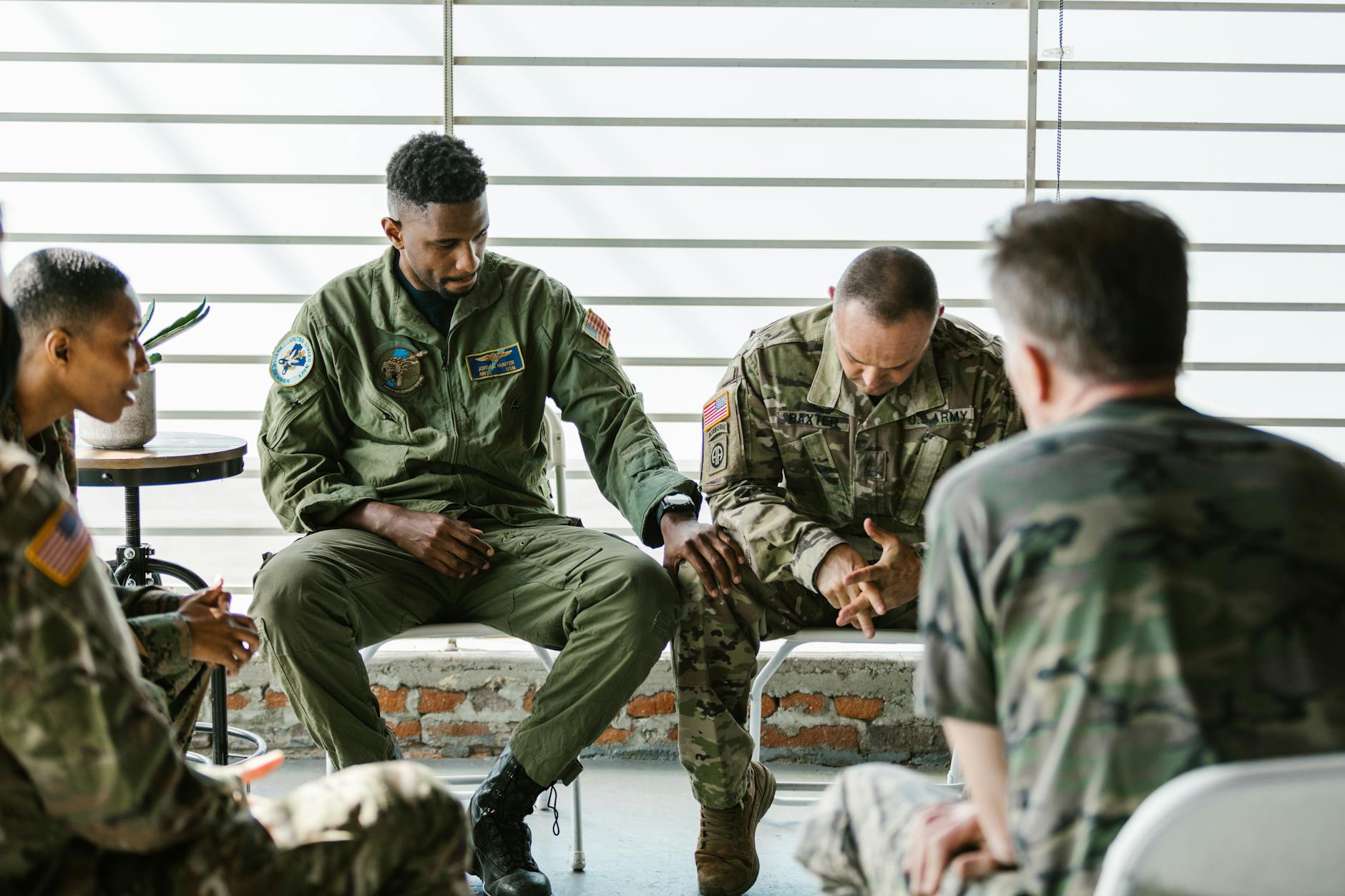 photo of men supporting each other
